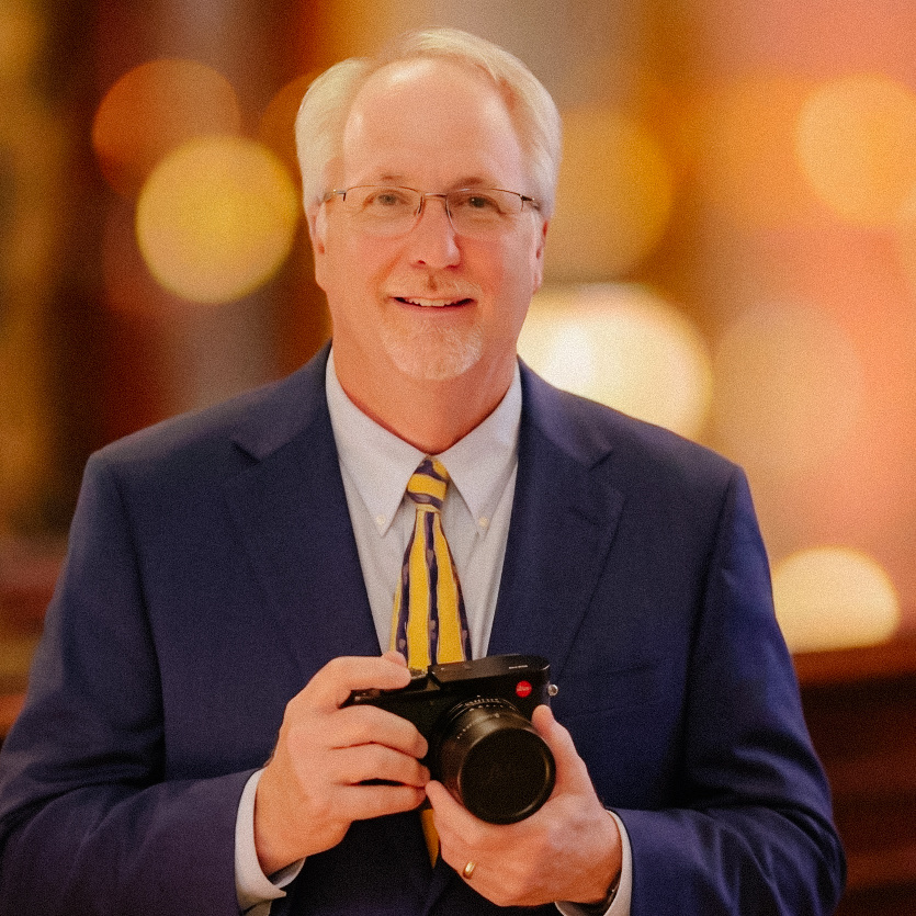 Doug Beigie holding a camera